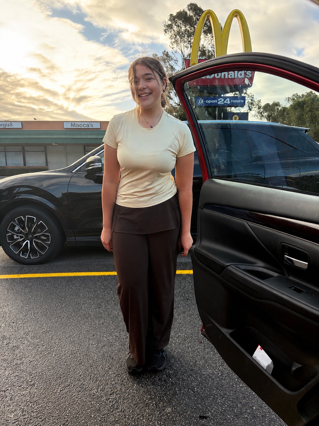 Portrait beside a car