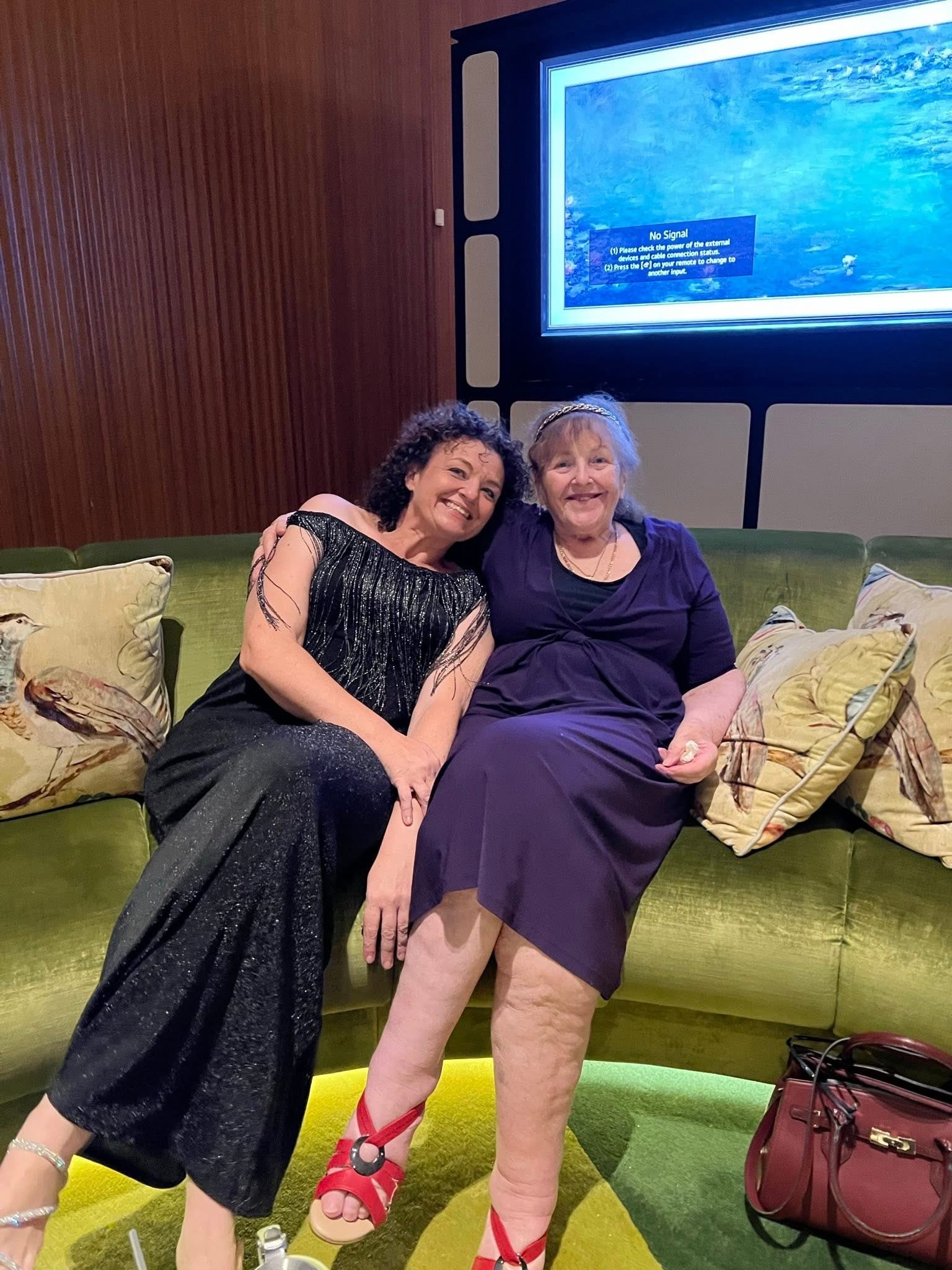 Two people together on the sofa