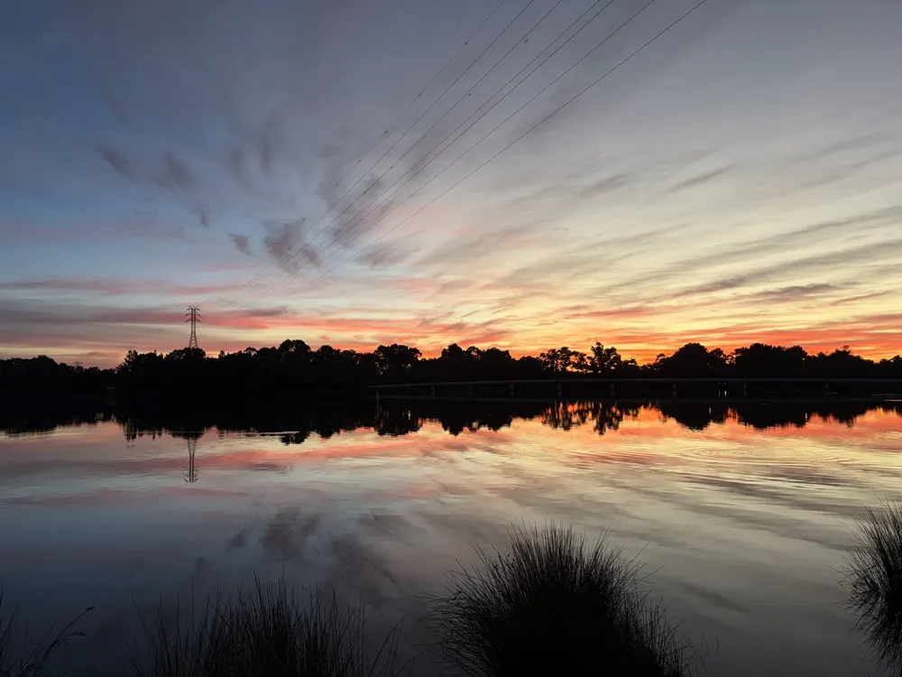 Orange sunset reflected in still water